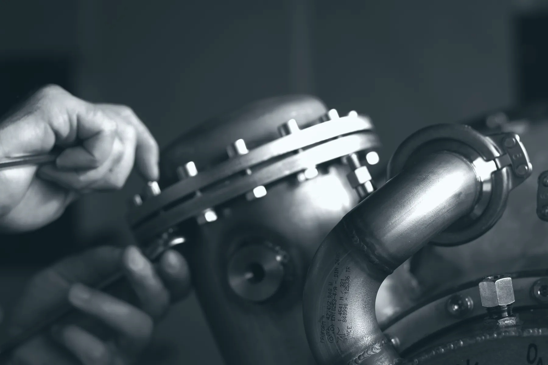 Hands assembling a flange